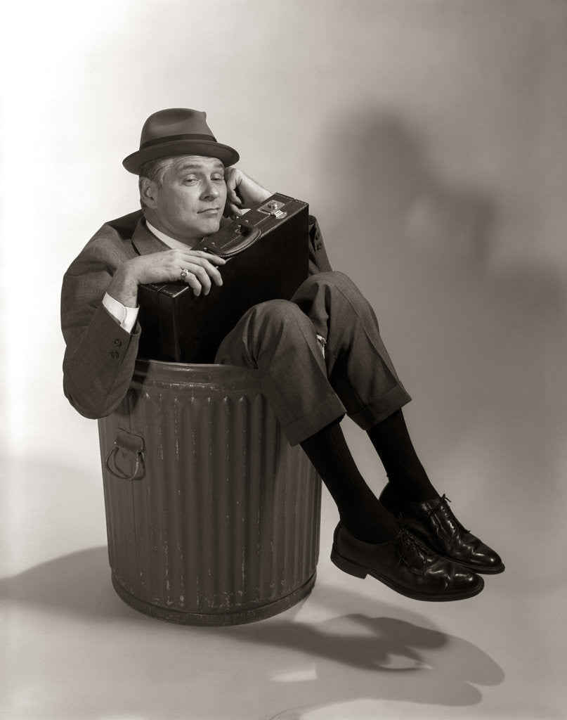 Detail of 1960s Fired Businessman Sitting In Trash Can by Anonymous