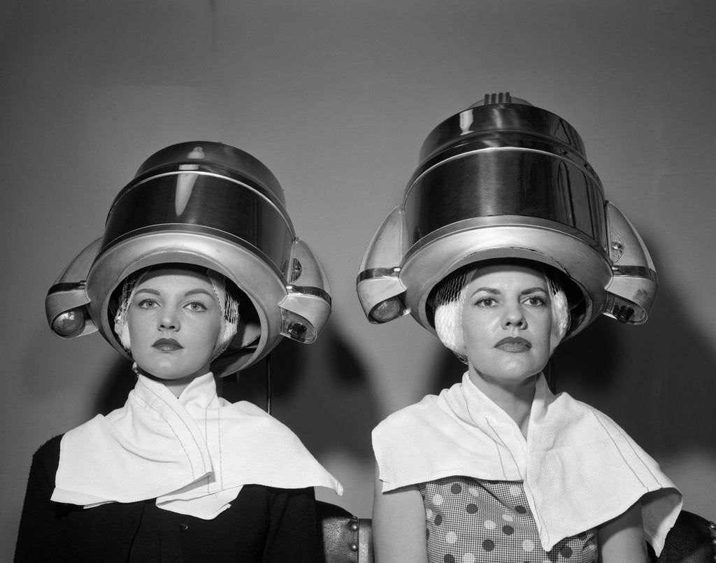 Detail of 1950s Two Women Under Hair Dryers Towels Around Shoulders Hair Nets by Corbis