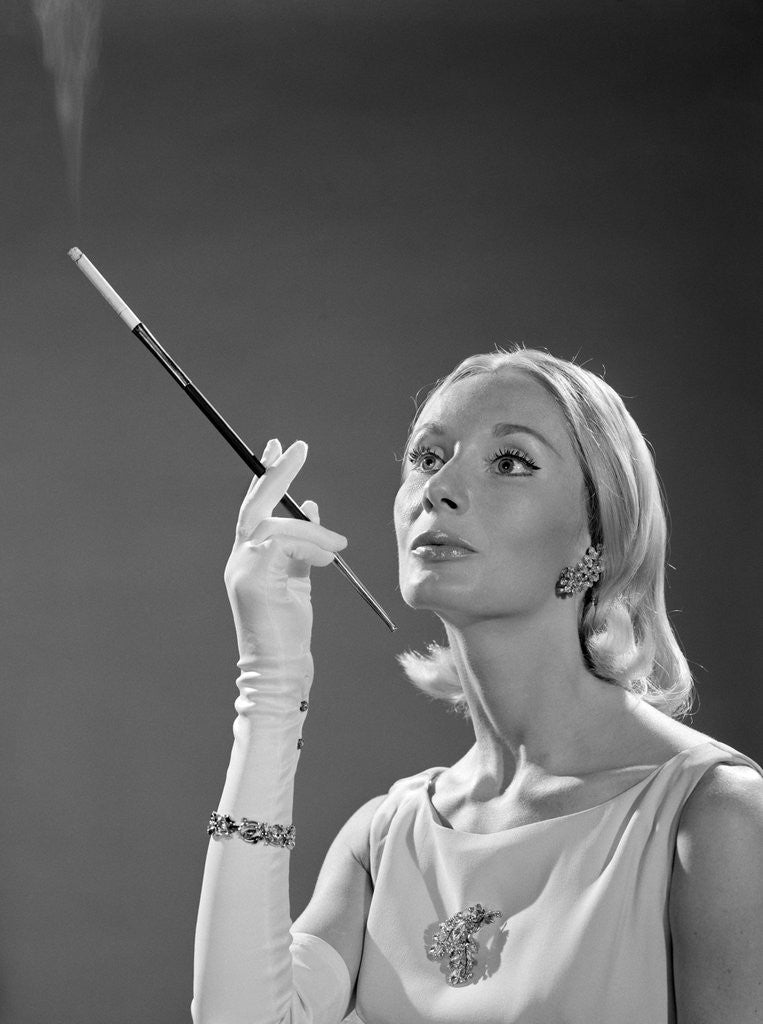 Detail of 1960s Elegant Woman Wearing Gown With French Cigarette Holder by Anonymous