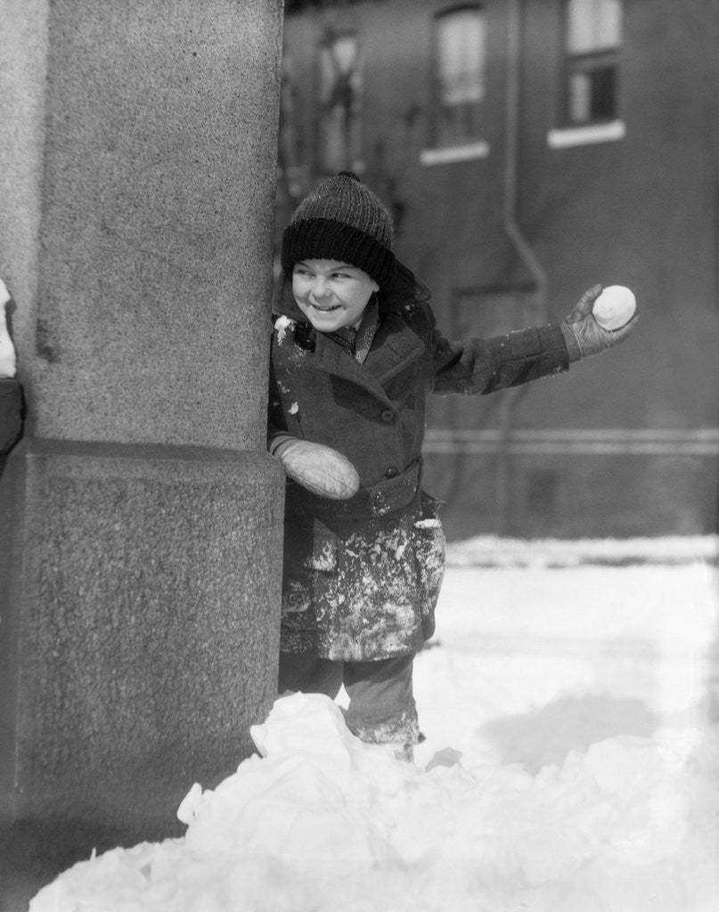 Detail of 1930s Boy Peeking Around Side Building Throwing A Snowball Winter by Anonymous
