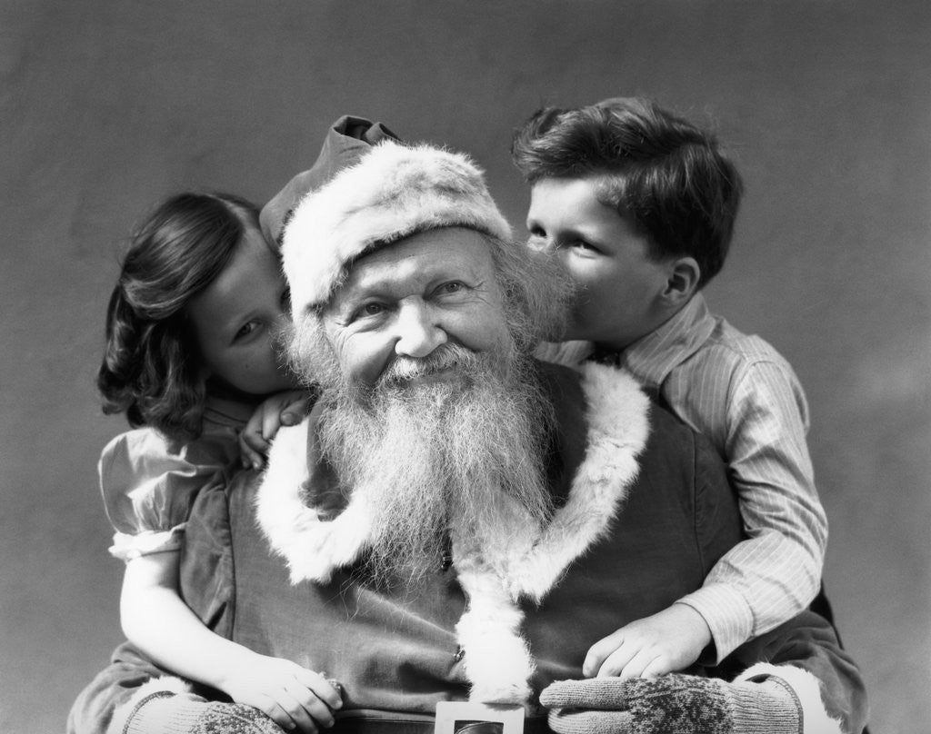 Detail of 1930s Man Santa Claus Posing With Boy And Girl Whispering In His Ears by Anonymous