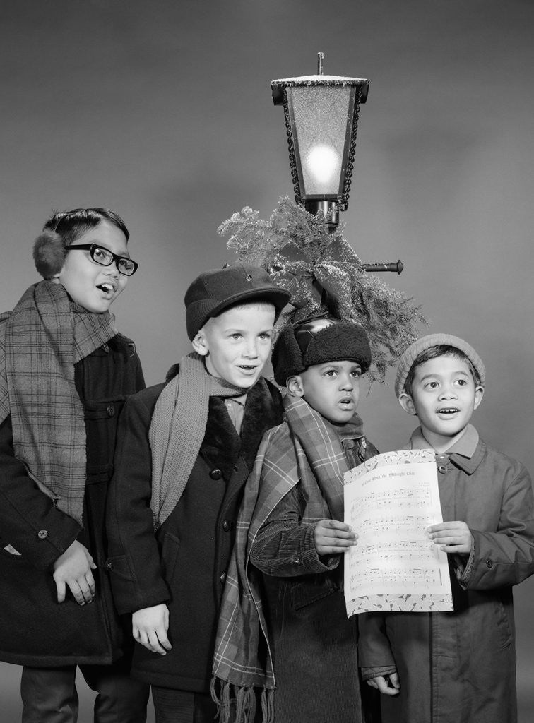 Detail of 1960s Boys Singing Christmas Carol Together Standing By Outdoor Porch Light by Anonymous