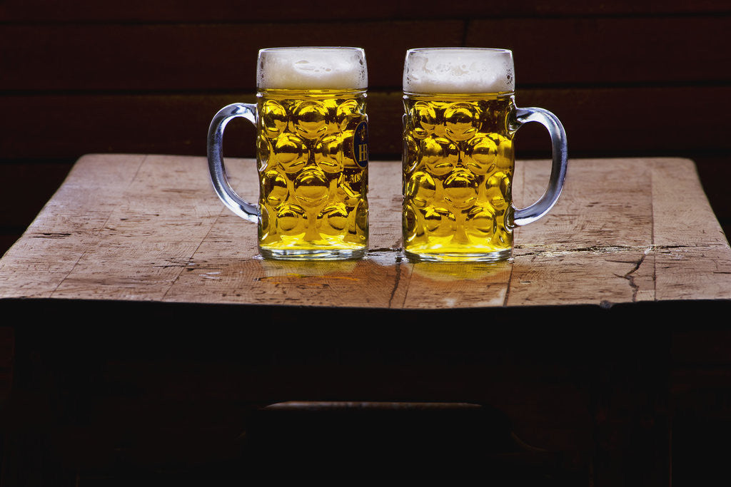Detail of Two Glass Mugs of Beer on Table by Anonymous
