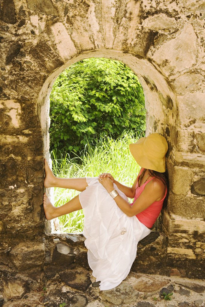 Detail of Young Woman Sitting in Window in Old Stone Wall by Anonymous