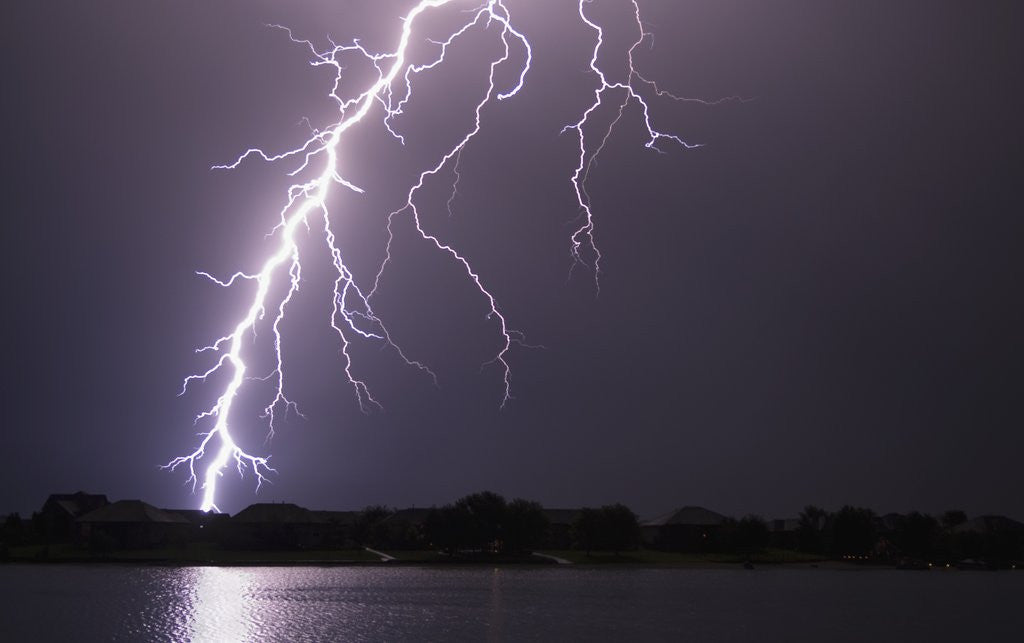 Detail of Lightning Striking Ground Near Residential Lake by Anonymous