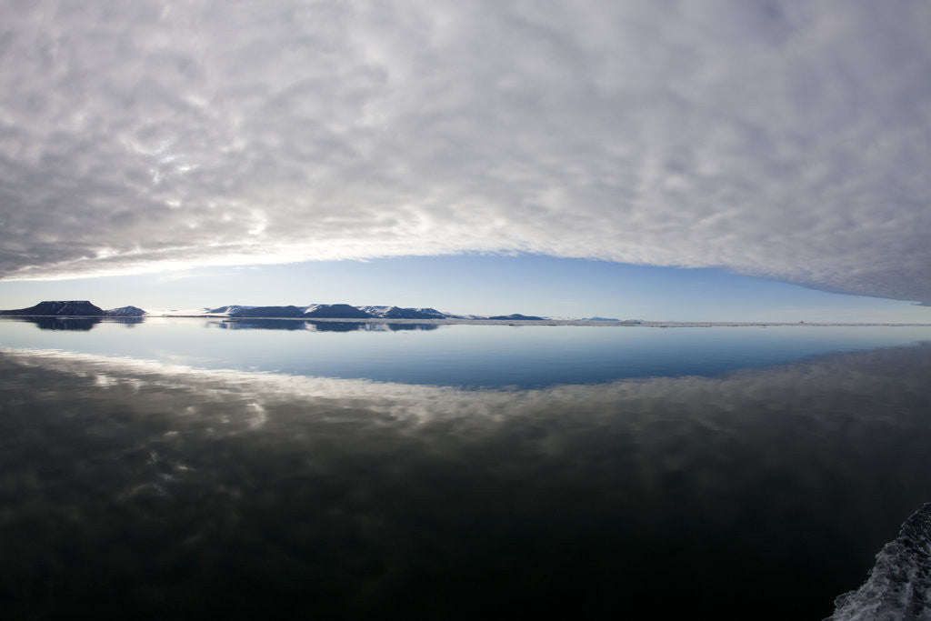Detail of Reflection of Low Clouds in Calm Sea at Edgeoya Island by Corbis