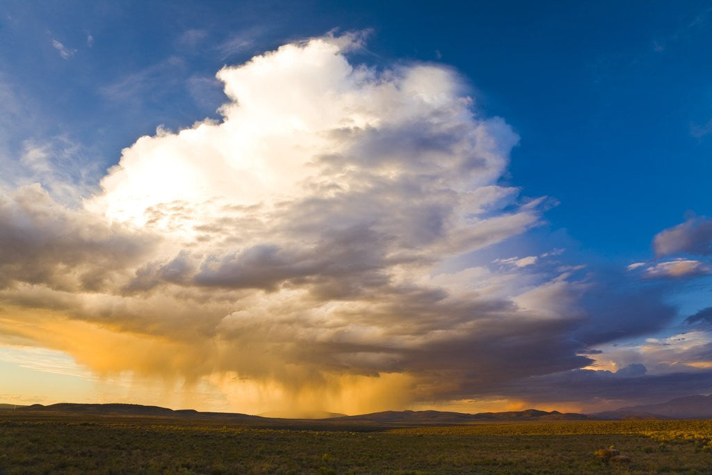 Detail of Rain clouds moving across landscape by Corbis