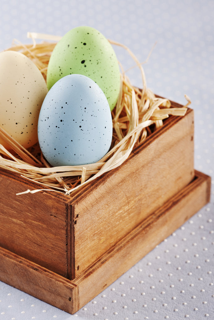Detail of Dyed Easters eggs in wooden box with straw by Anonymous
