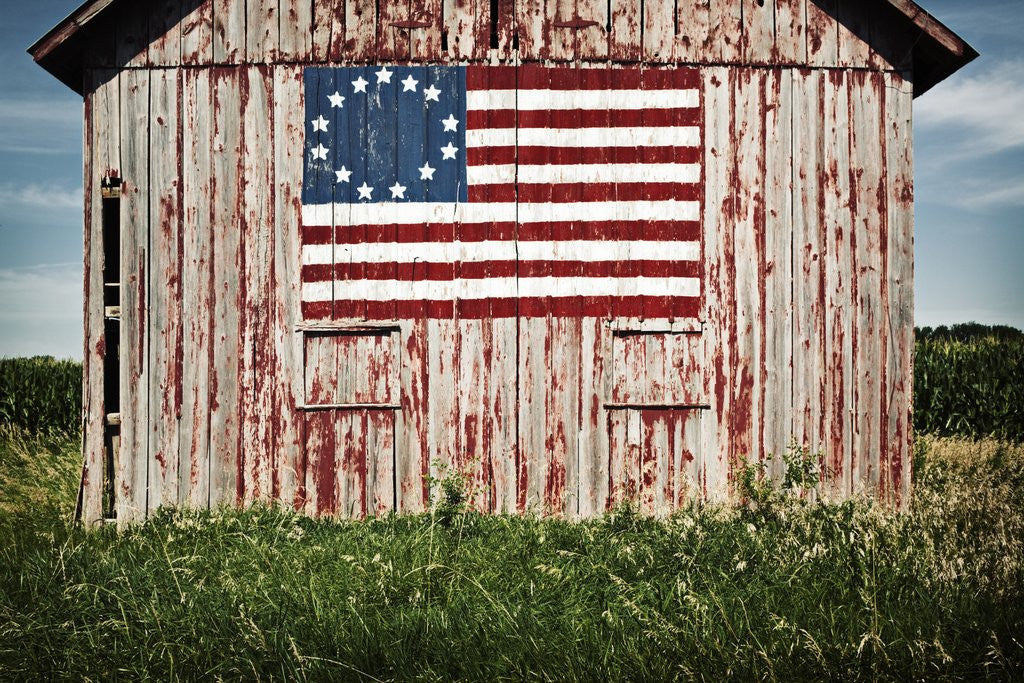 Detail of American flag painted on barn by Corbis