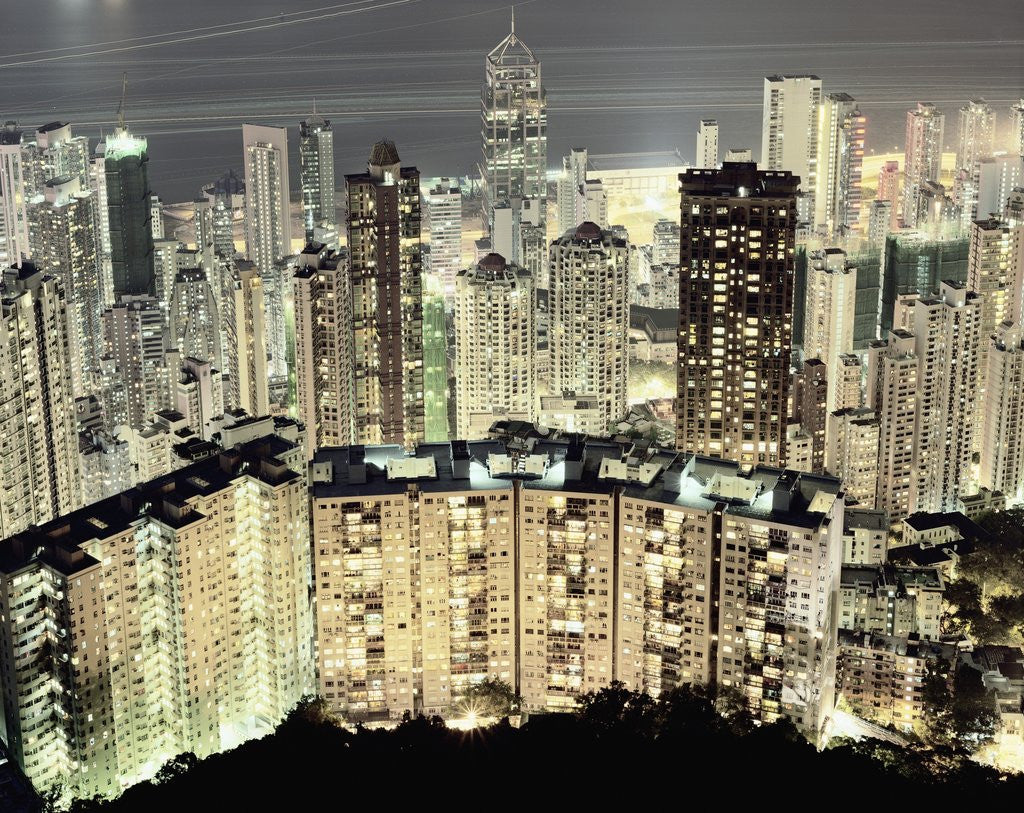 Detail of Hong Kong skyscrapers and apartment blocks at night by Corbis