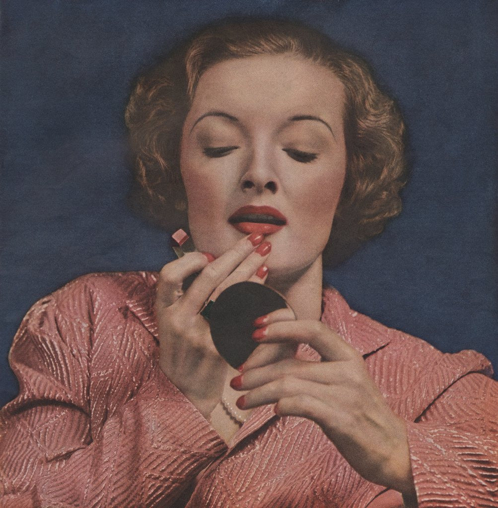 Detail of Woman putting on lipstick by Anonymous