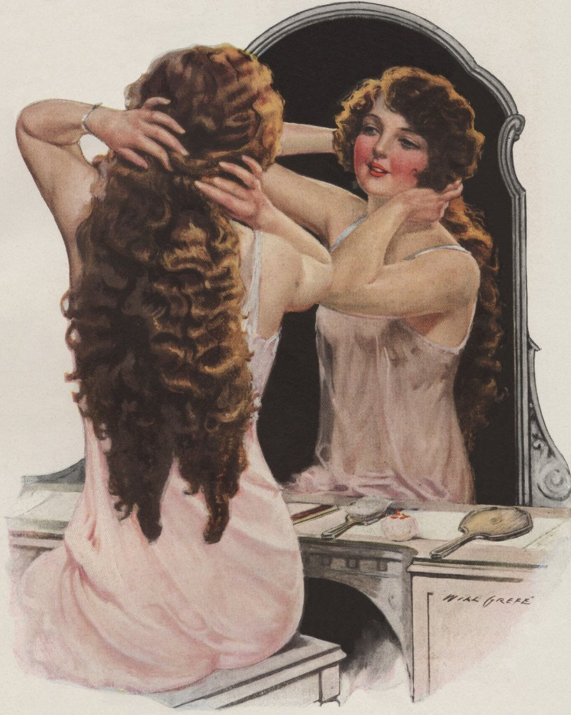 Detail of Brunette fixing hair in mirror by Corbis