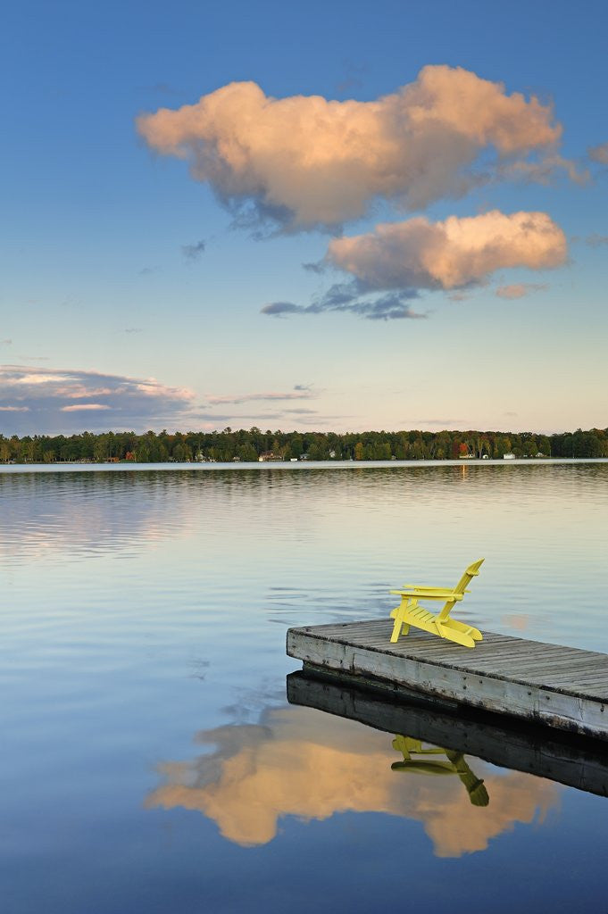 Detail of Clouds reflected in Silent Lake with Muskoka chair on dock by Anonymous