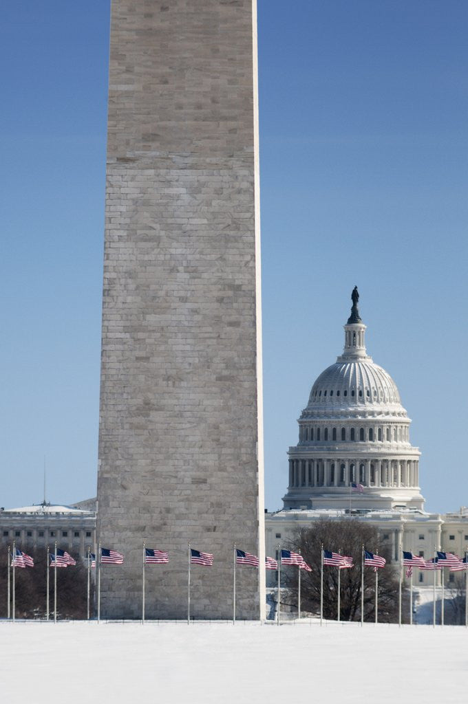 Detail of Snowy Washington Monument and U.S. Capitol building by Corbis