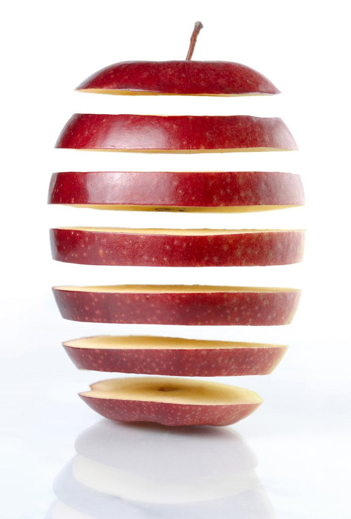 Detail of Conceptual Photo of a Sliced on Seven Parts and Disassembled Red Apple Silhouette on White Background Genetically Modified Food Gene Engineering Abstract Concept by Anonymous
