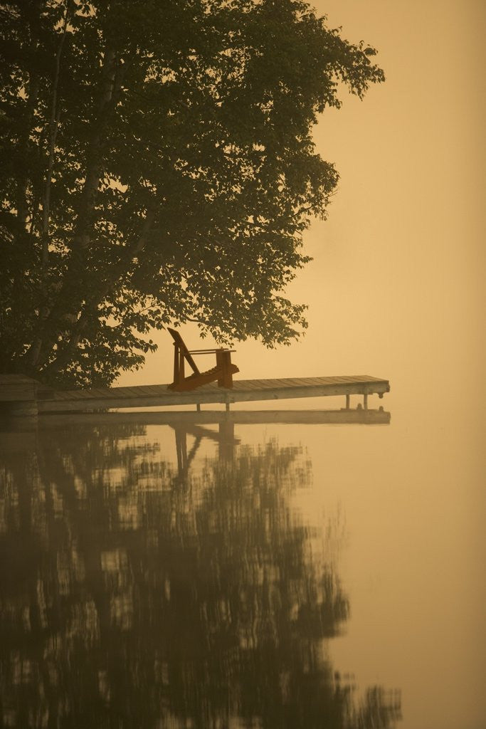 Detail of Adirondack chair on dock by Anonymous