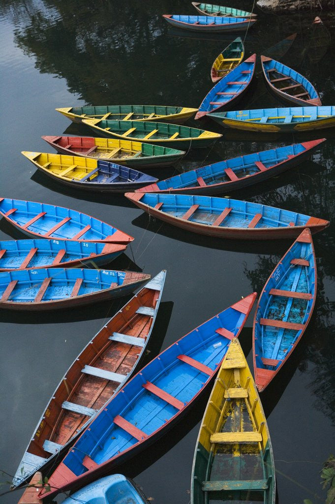 Detail of Canoes floating on water by Corbis