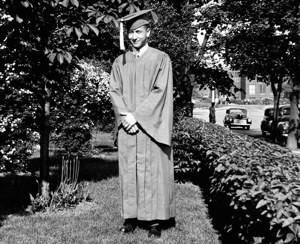 Detail of HIgh school grad poses in his cap and gown, ca. 1944 by Anonymous