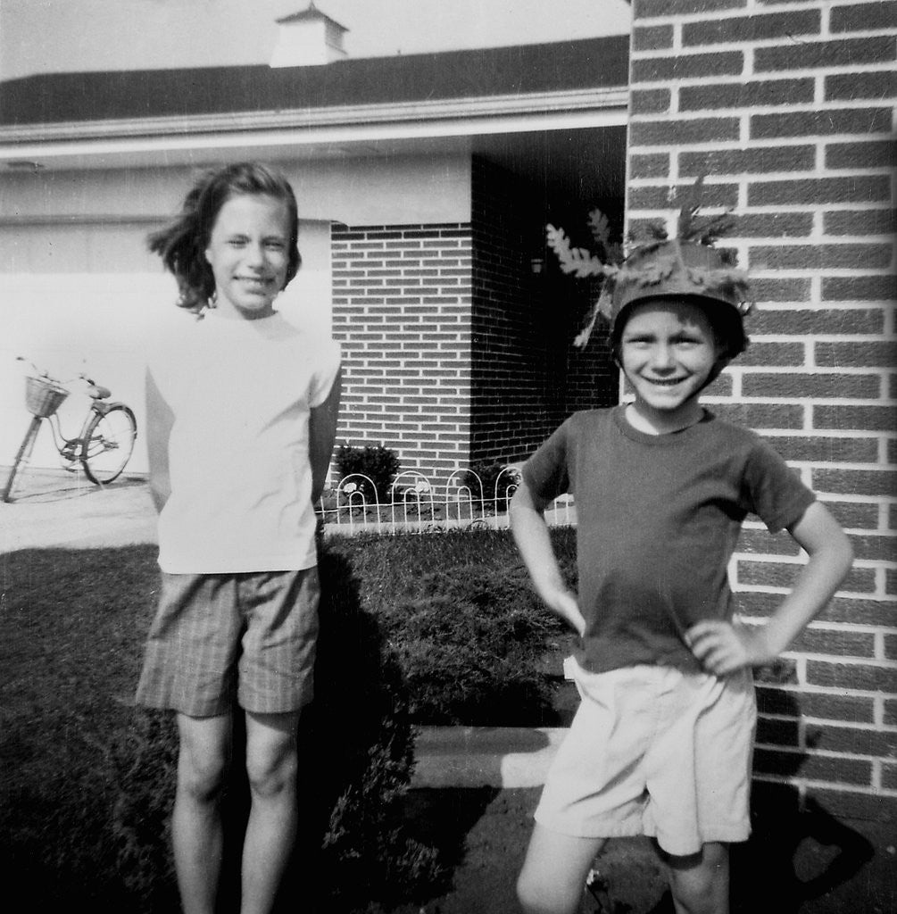 Detail of Brother and sister playing in front of their house, ca. 1965 by Anonymous