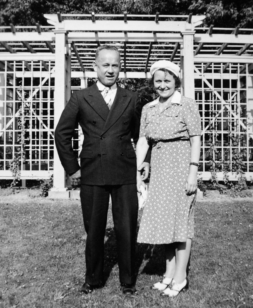 Detail of Middle aged couple pose on the lawn, ca. 1939 by Anonymous