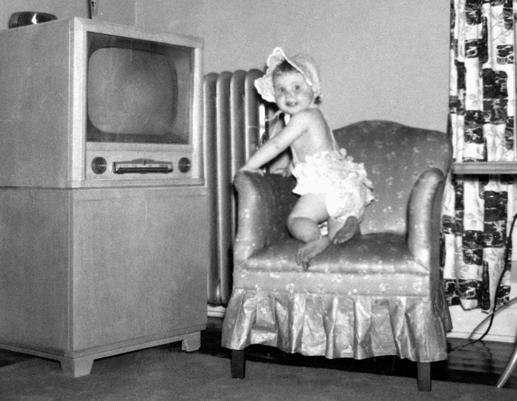 Detail of Baby girl wants to watch television, ca. 1954 by Anonymous