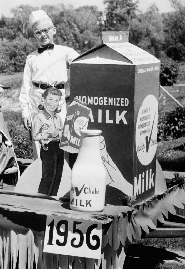 Detail of Ten year old boy rides on a parade float promoting milk in Wisconsin, ca. 1956 by Anonymous