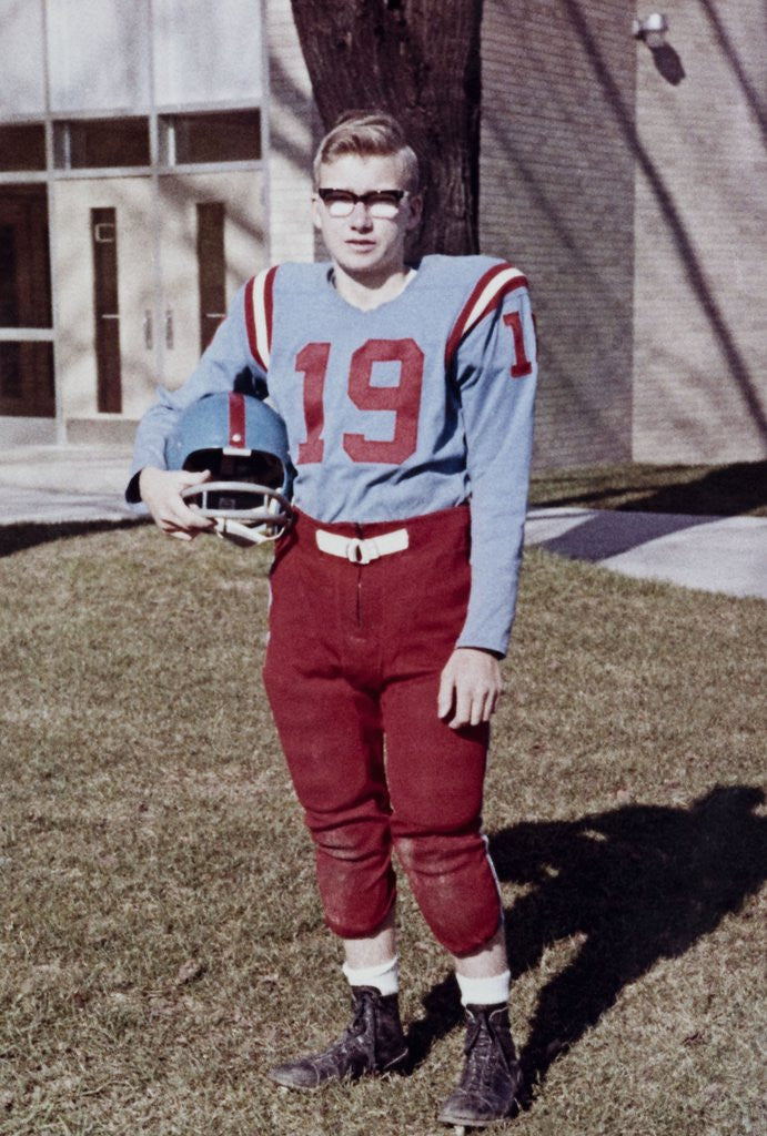 Detail of Fifteen year old high school football player portrait outside the school, ca. 1961 by Anonymous