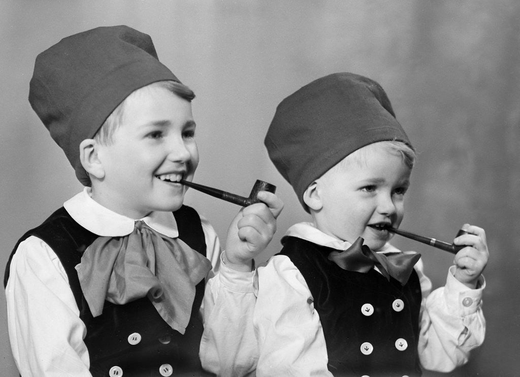 Detail of Two brothers in Bavarian costumes pretend to smoke pipes, ca. 1947 by Corbis