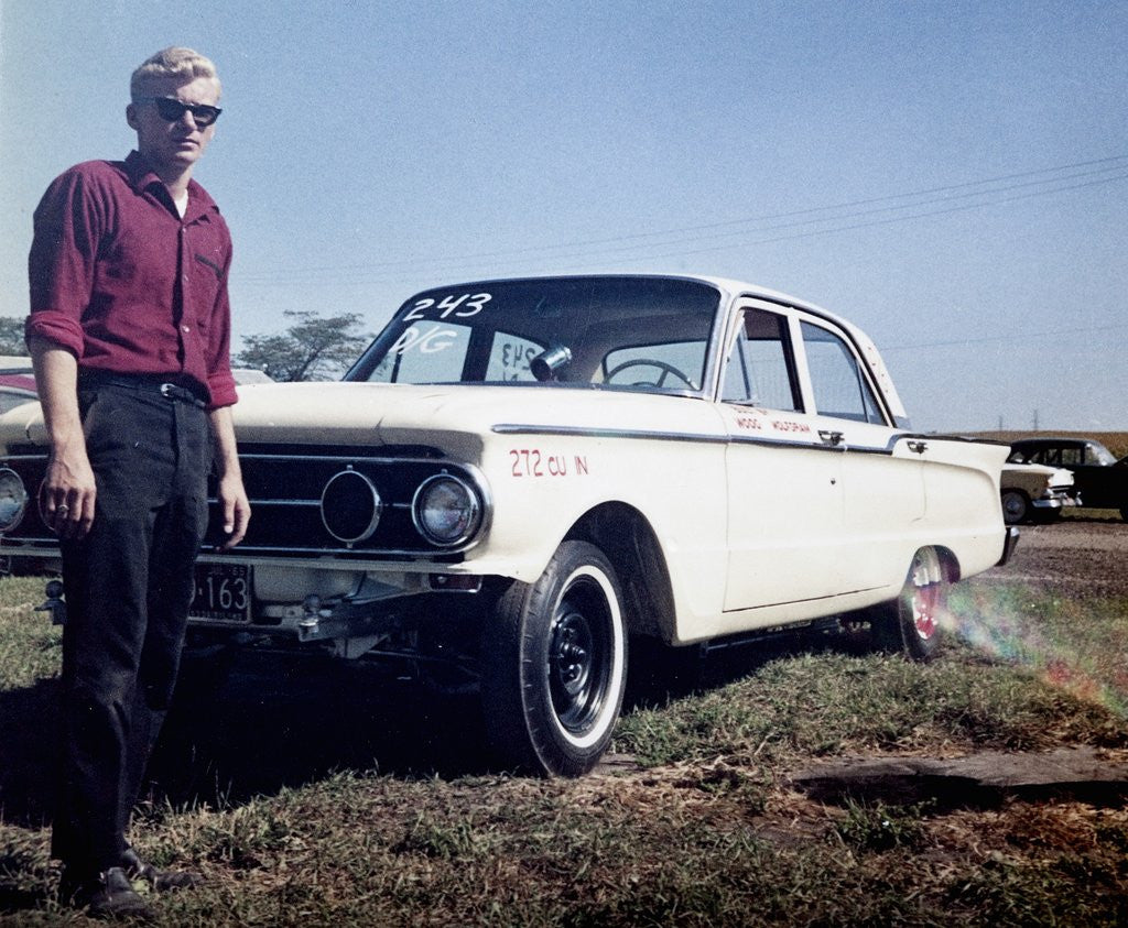 Detail of Sixteen year old boy stands with his 1960 Mercury Comet automobile, ca. 1962 by Anonymous