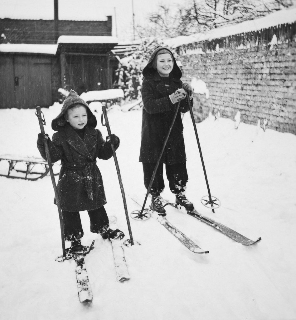 Detail of Two brothers stand on their skis in the snow, ca. 1950 by Anonymous