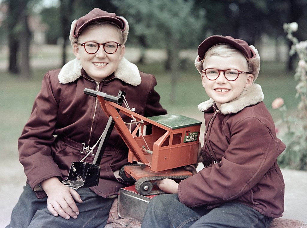 Detail of Two brothers play with a Buddy L steam shovel toy in Wisconsin, ca. 1953 by Anonymous