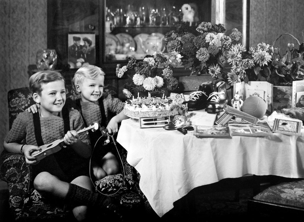 Detail of Brothers, ages 8 and 3, pose with birthday presents, ca. 1949 by Anonymous