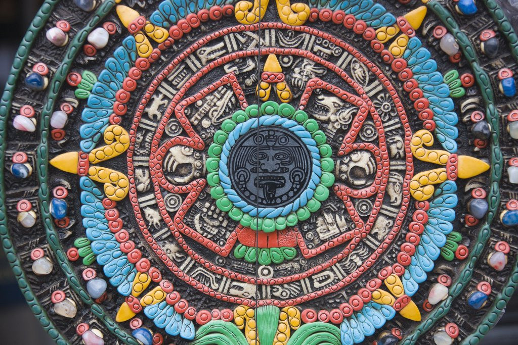 Detail of Carved and painted Aztec calendar design by Corbis