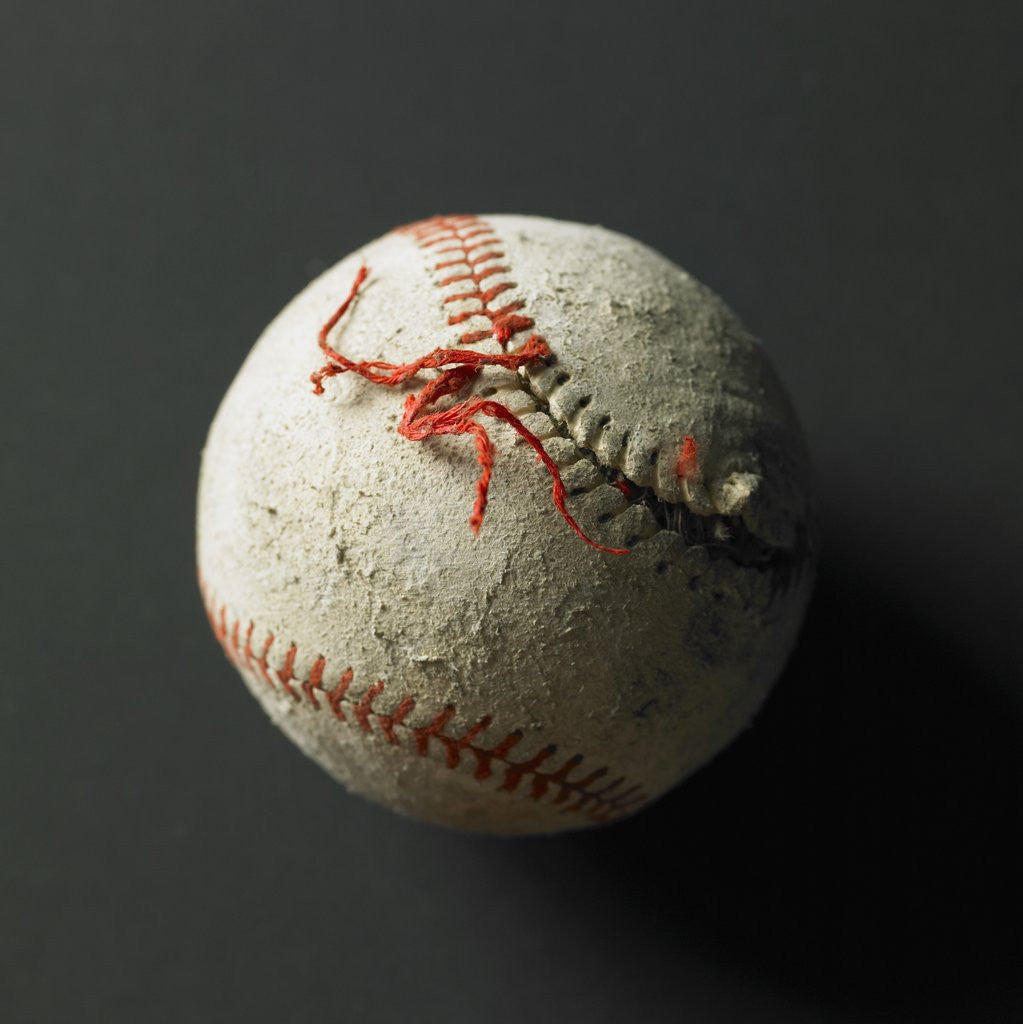 Detail of An old baseball with its stich ripped by Corbis