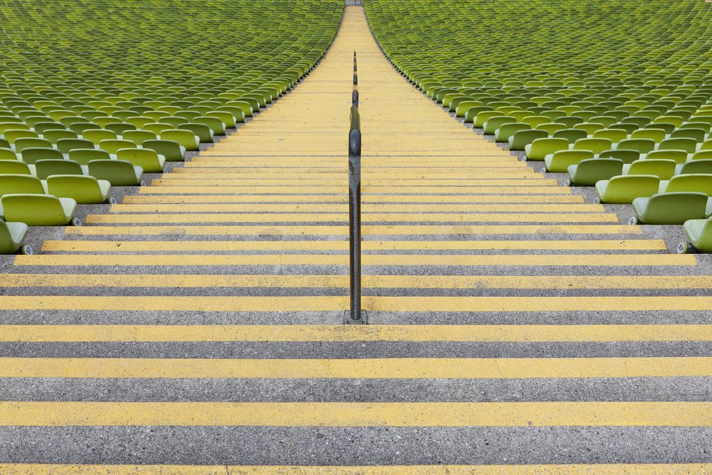 Detail of Stadium stairway between rows of green seats by Anonymous