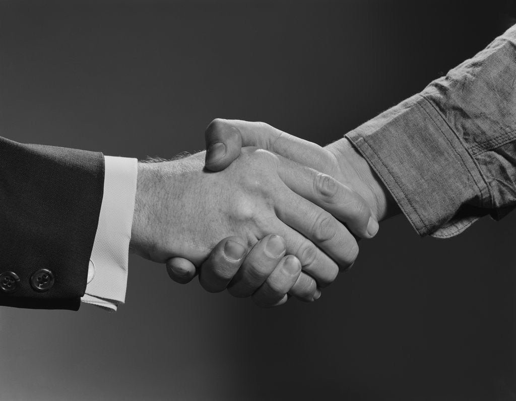 Detail of Close-up handshake between businessman and laborer by Anonymous