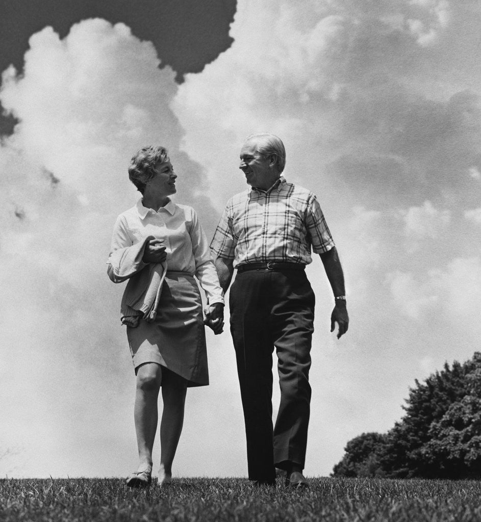 Detail of Mature couple walking holding hands by Anonymous