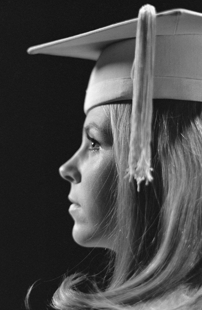 Detail of Profile blond female graduate wearing white mortarboard by Anonymous