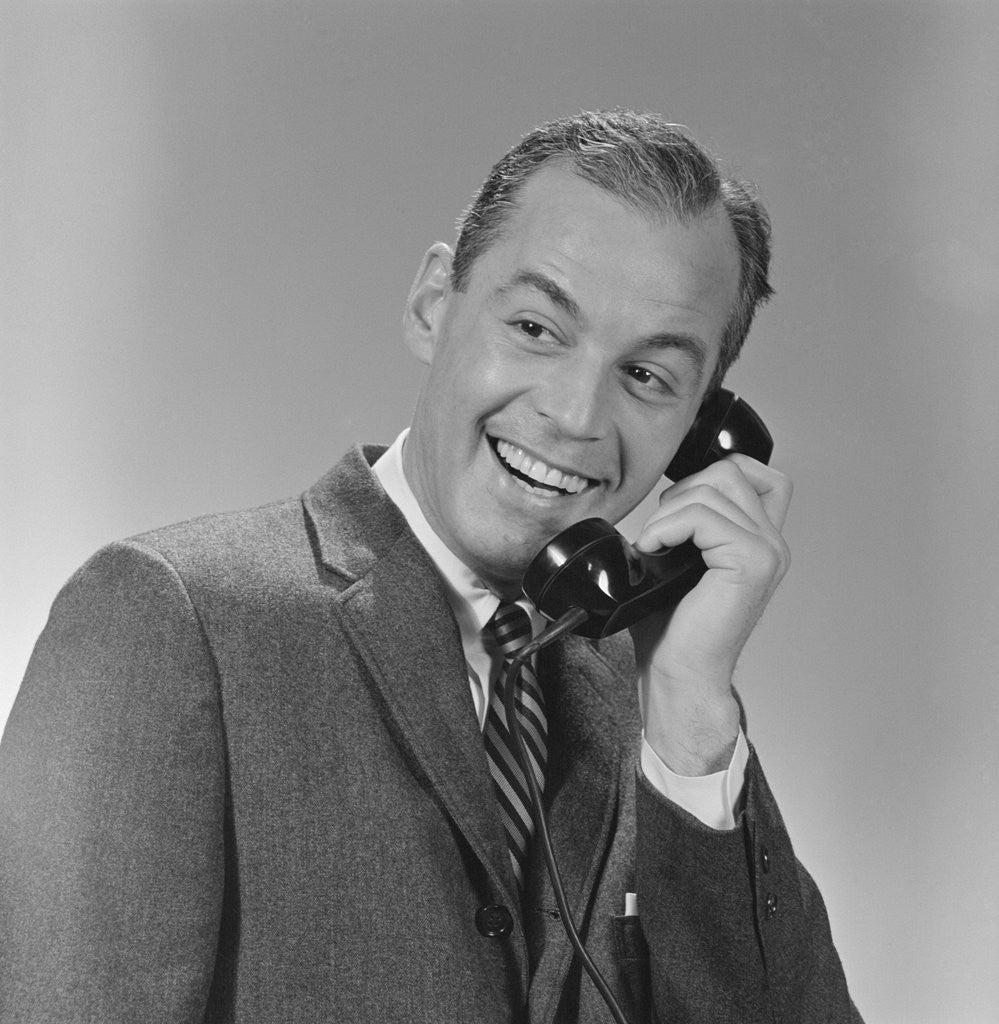 Detail of Smiling business man telephone conversation by Anonymous
