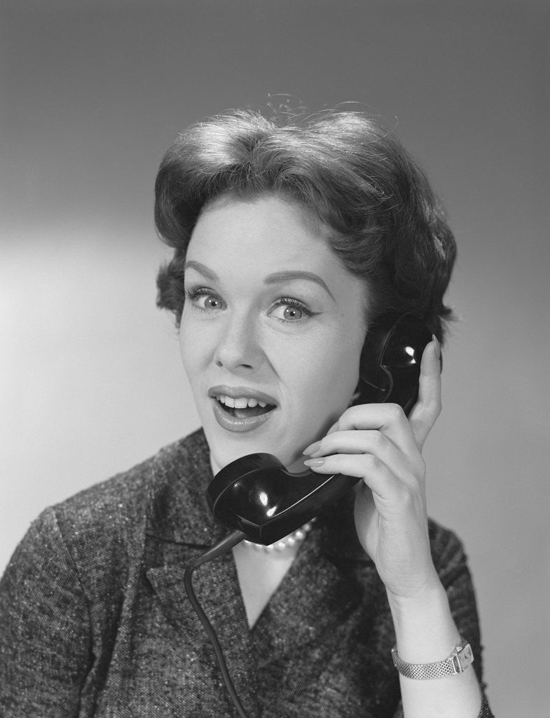 Detail of Happy smiling woman having telephone conversation by Corbis