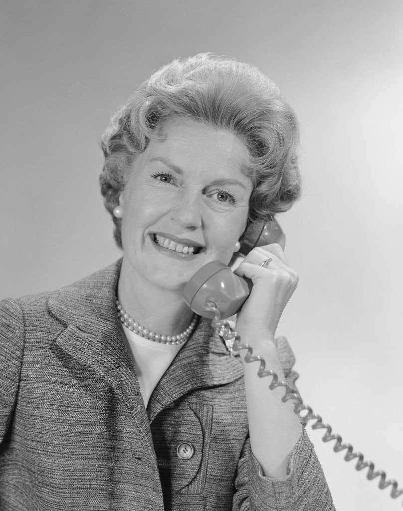 Detail of Portrait smiling mature woman talking on telephone by Anonymous