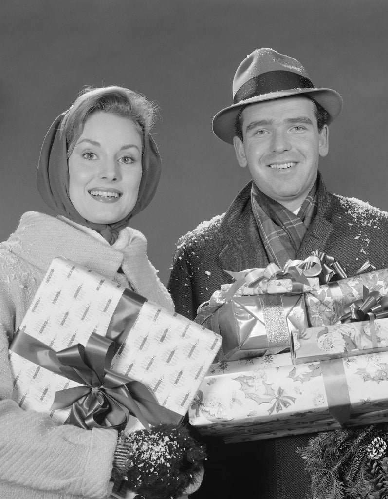 Detail of Couple man and woman holding wrapped christmas presents and packages by Anonymous