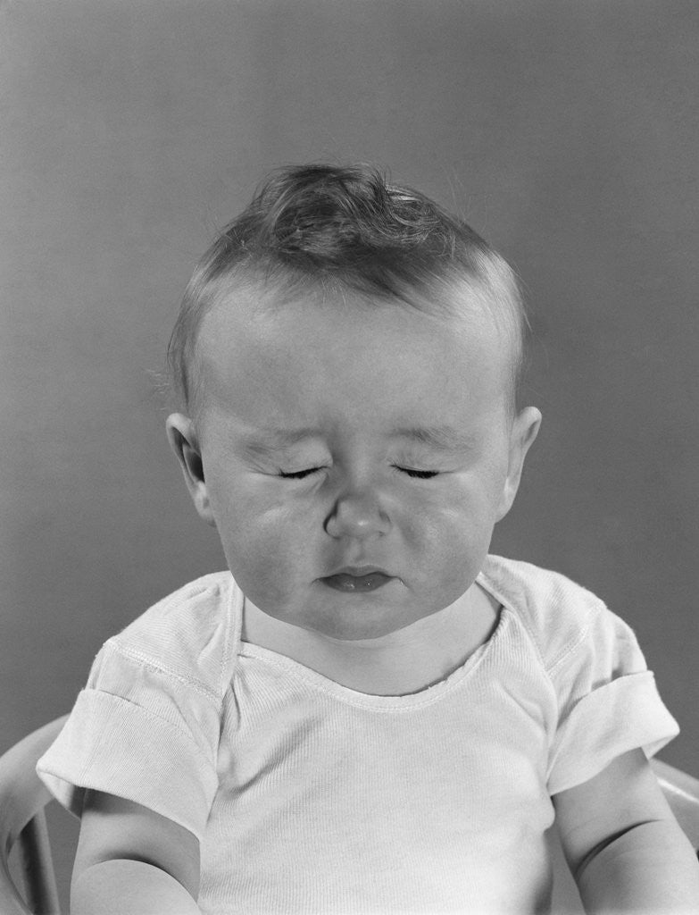 Detail of Portrait baby with eyes tightly closed by Anonymous