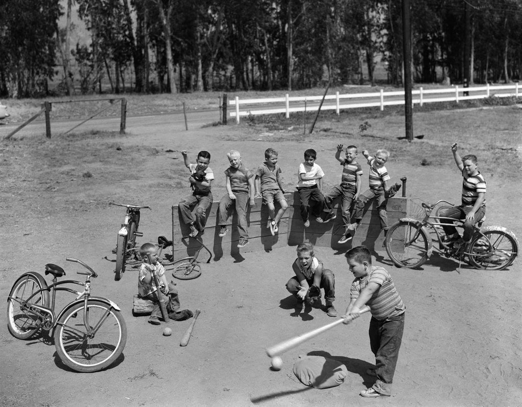 Detail of 10 neighborhood boys playing sand lot baseball most wear blue jeans tee shirts by Anonymous