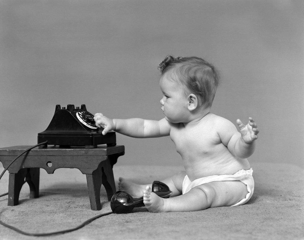 Detail of Baby in diaper dialing telephone by Anonymous