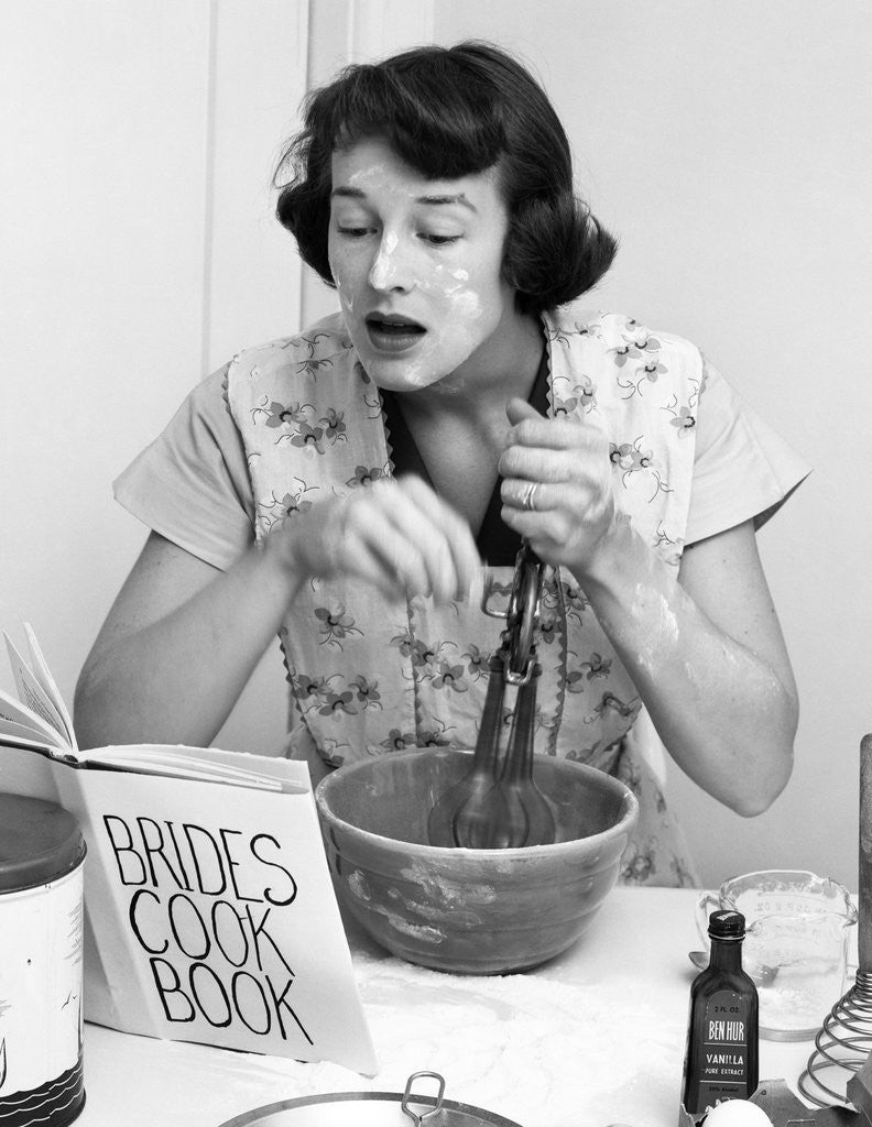 Detail of Woman face covered flour mixing ingredients reading brides cook book by Anonymous