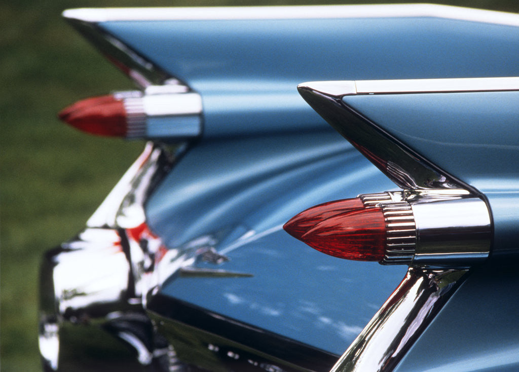 Detail of Detail fins rear tail lights blue cadillac auomobile by Anonymous