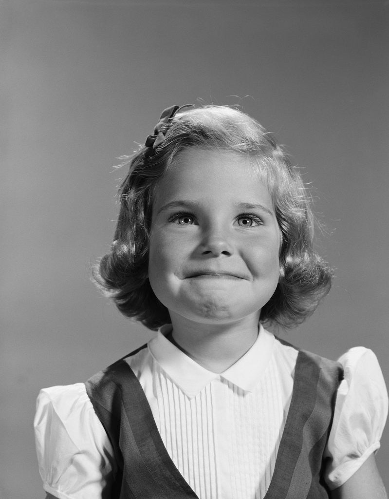 Detail of Little girl portrait with mischievous smile by Anonymous