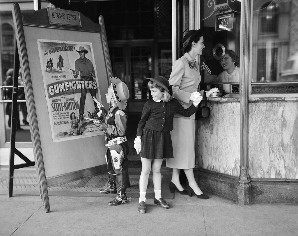 Detail of Mother and 2 children buying tickets to movie matinee boy wearing cowboy costume by Anonymous