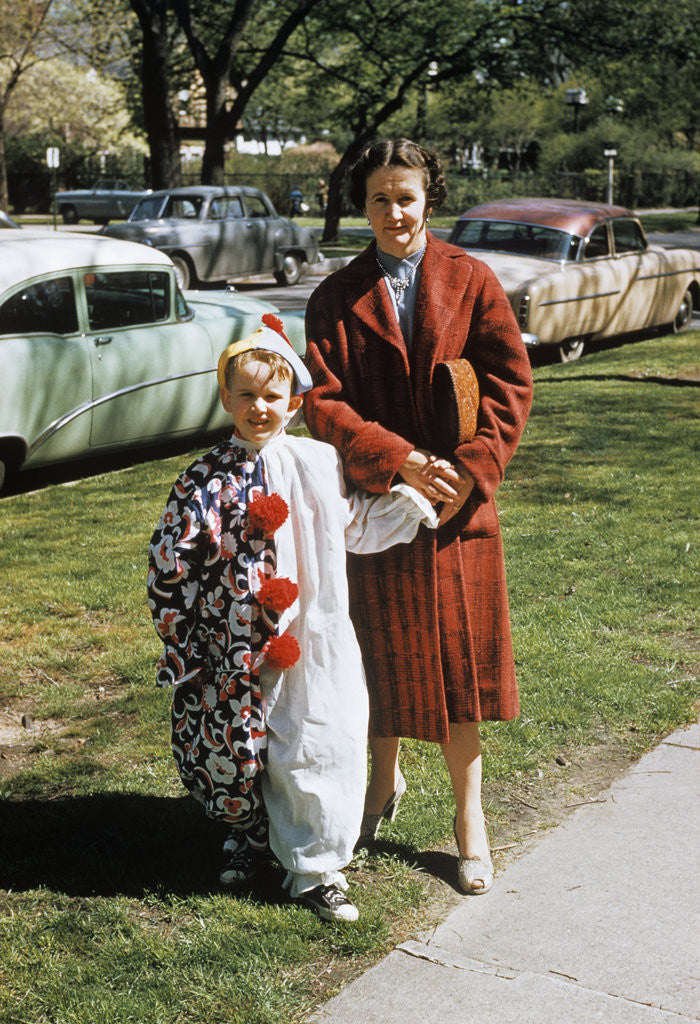Detail of Mother with son dressed in clown suit outdoors by Anonymous